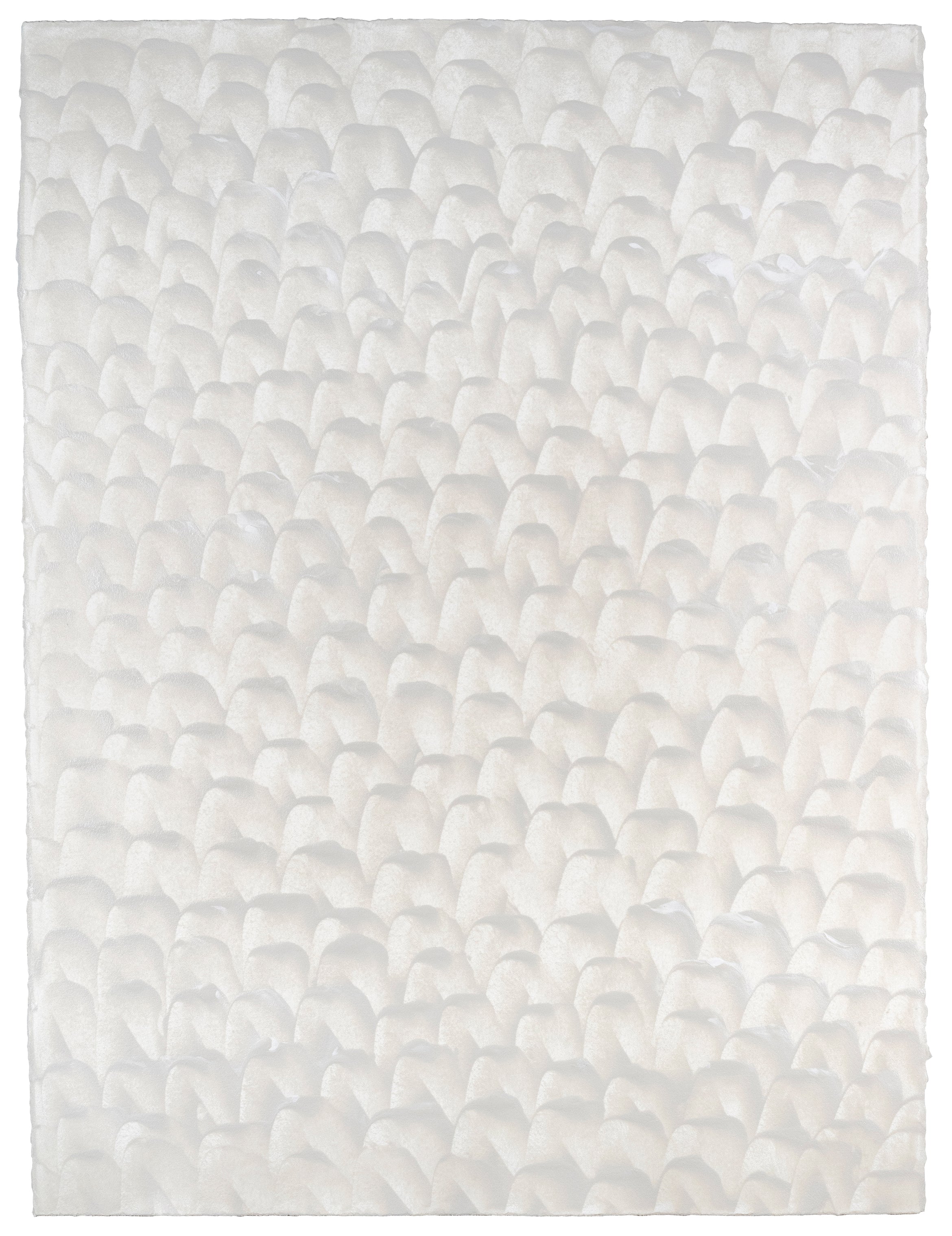 Sheet of hand-painted wallpaper with a repeating dappled texture in cream.