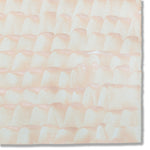 Detail of a hand-painted wallpaper swatch with a repeating dappled texture in light pink.