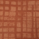 Broadloom carpet sample in a irregular plaid pattern in rust orange