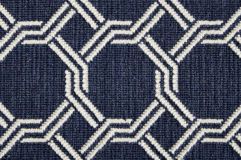 Broadloom carpet swatch in geometric pattern dark blue color