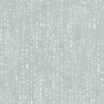 Detail of wallpaper in a painterly small-scale grid print in blue-gray on a white field.