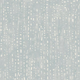 Detail of wallpaper in a painterly small-scale grid print in blue-gray on a white field.