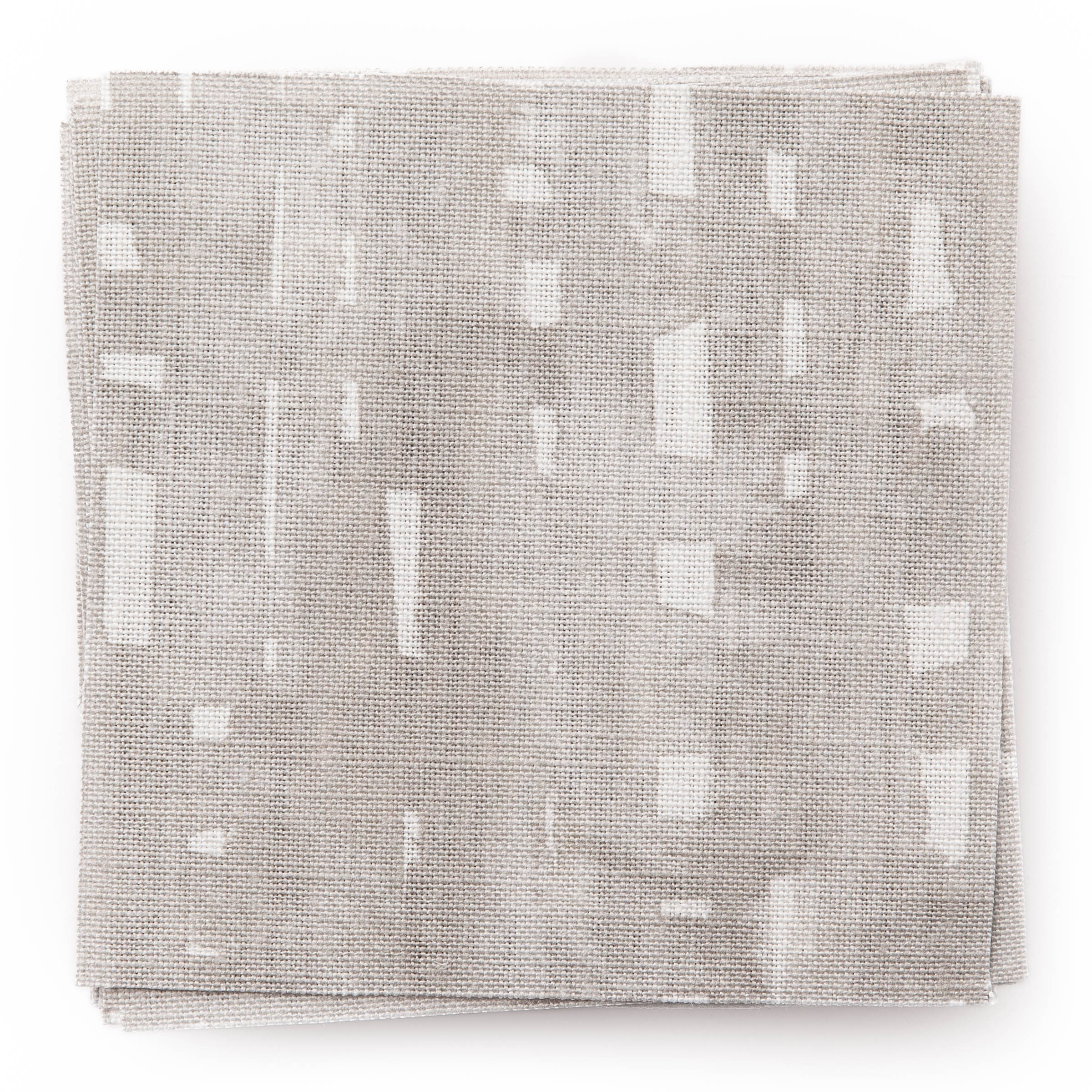A stack of fabric swatches in a painterly small-scale grid print in gray on a white field.