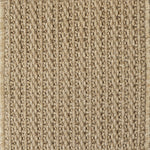 Close-up of a textured beige woven carpet