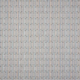 Patterned carpet with a geometric design in blue, grey tan, green and white