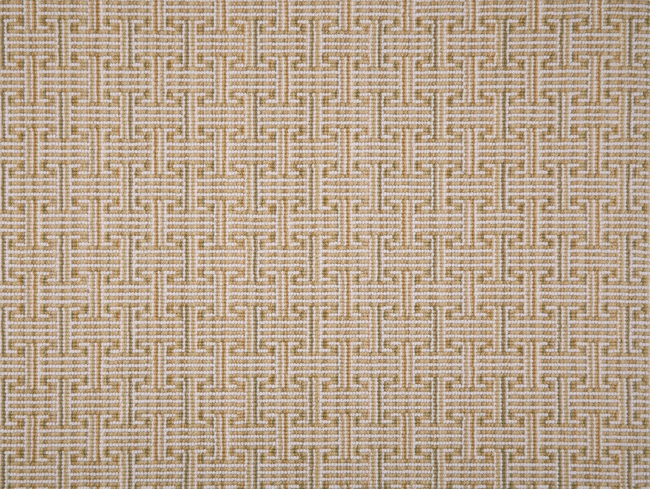 Patterned carpet with a geometric design in warm tan and white