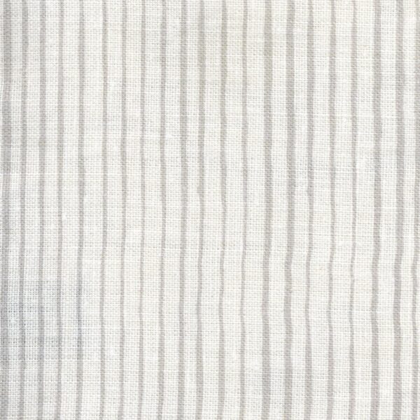 Fabric in a painterly stripe pattern in gray on a white field.