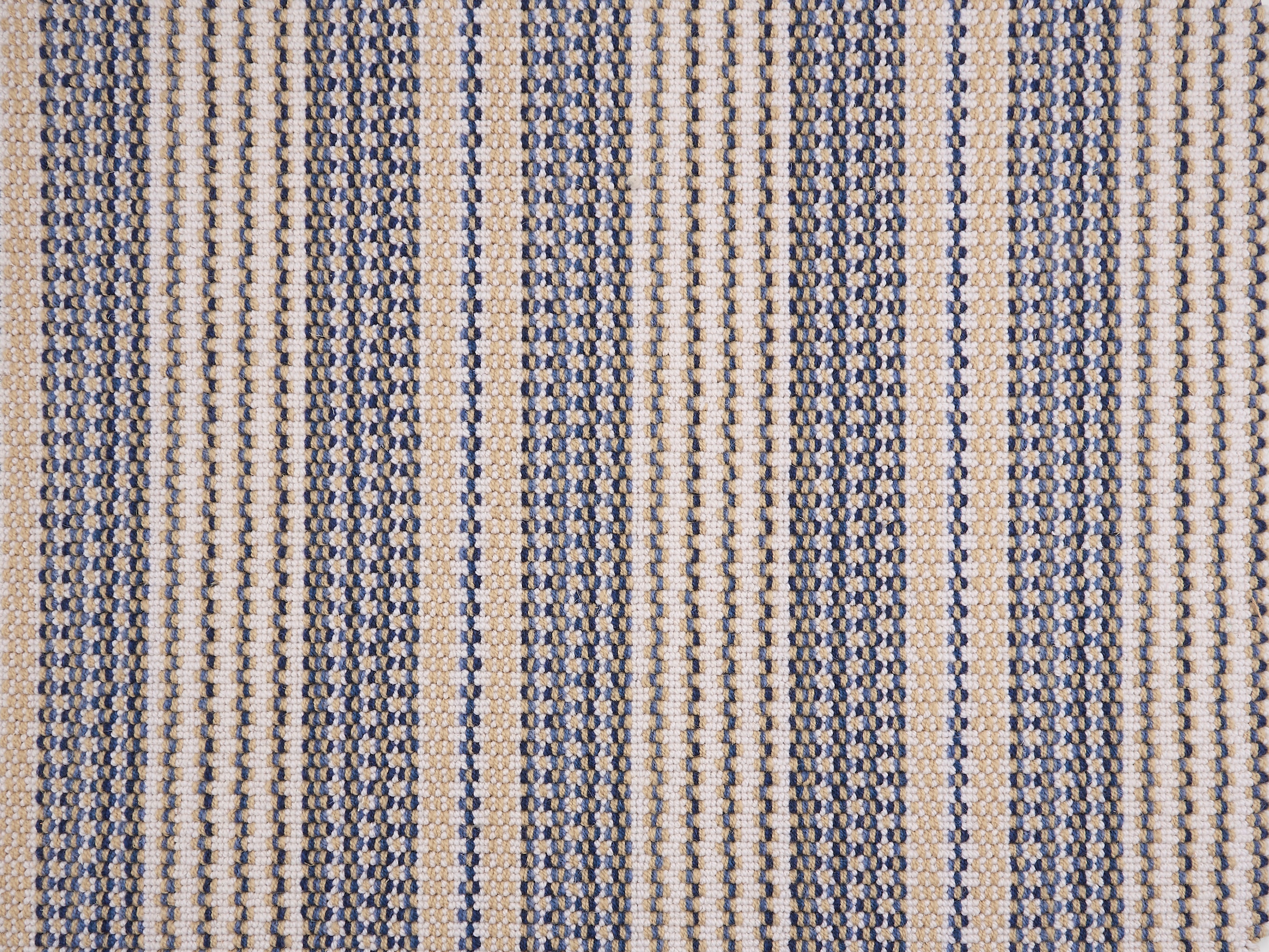 Broadloom carpet with blue and beige stripes