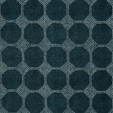 Detail of a printed linen fabric in a repeating gridded dot pattern in white on a navy field.