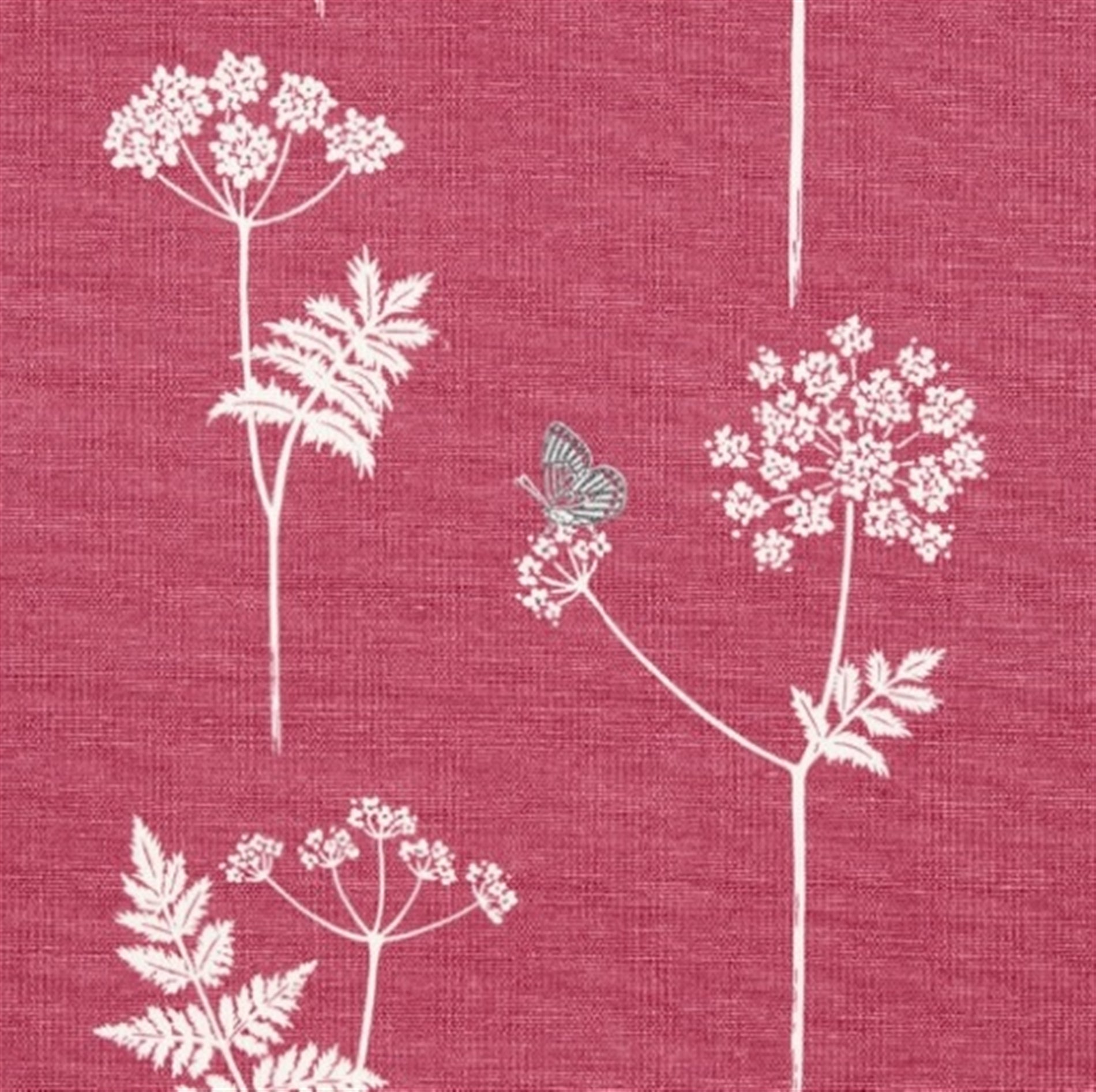 Detail of fabric in a playful flower and butterfly print in white and green on a red field.