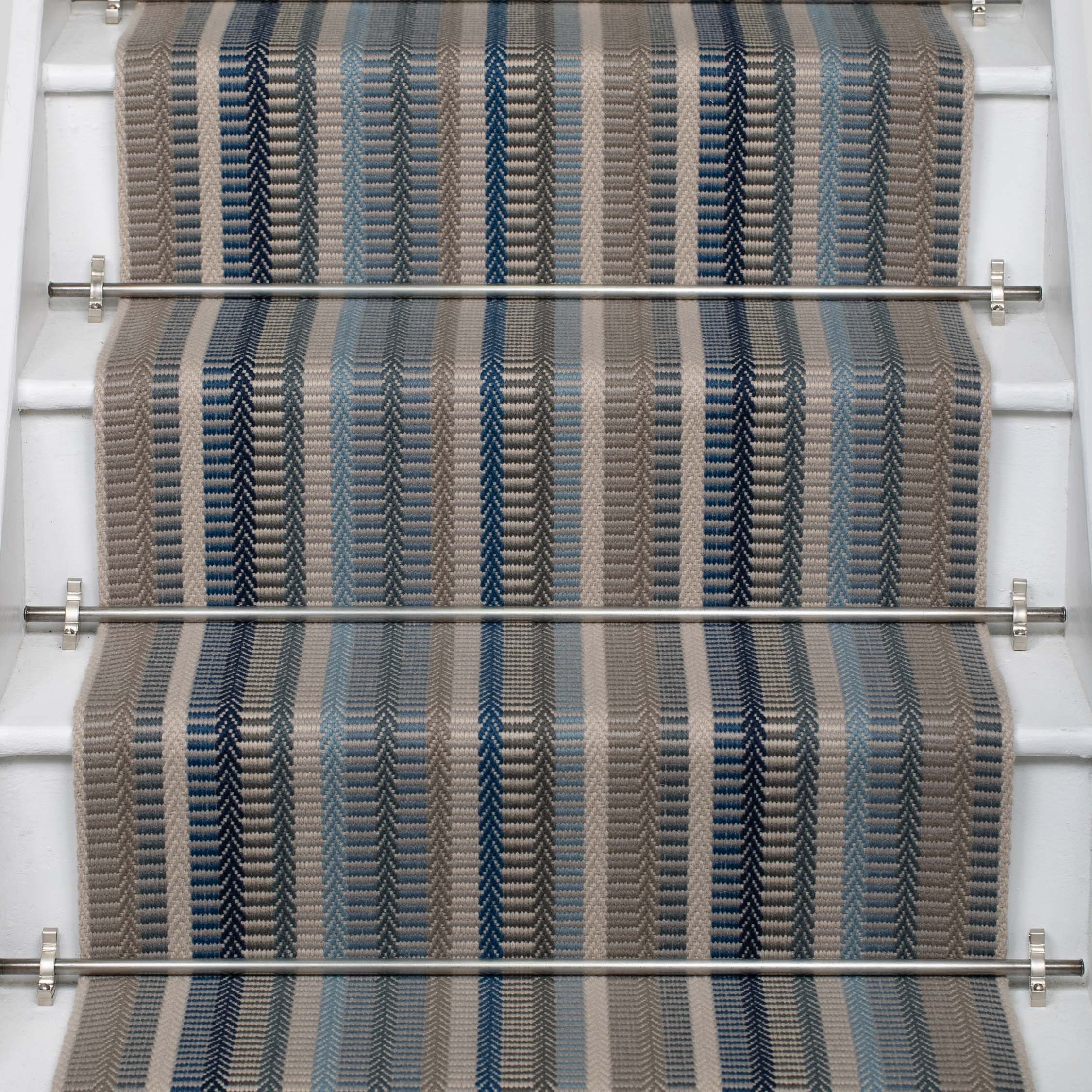 Striped flatweave runner in blue and grey on white staircase