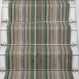 Striped flatweave runner in green and grey on white staircase