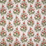 Patterned fabric with red flowers and green leaves on a beige background