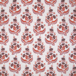 Patterned fabric with purple and red floral design on a white background