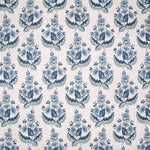 Patterned fabric with blue floral design on a white background