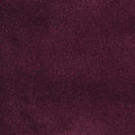 Detail of velvet fabric yardage in dark purple.