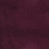 Detail of velvet fabric yardage in dark purple.