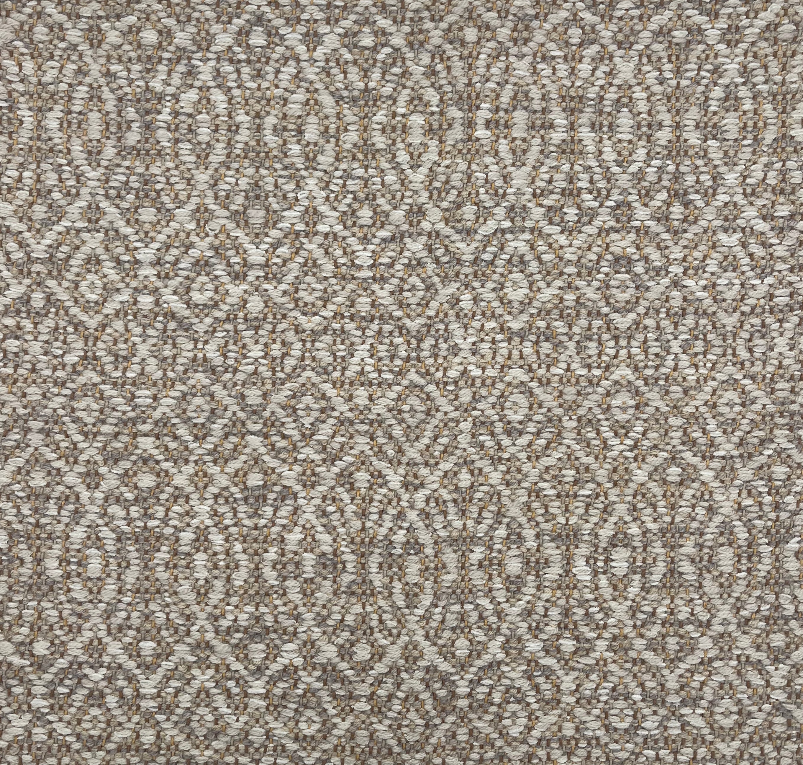 Handwoven rug detail in a contemporary design in grey and beige