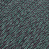 Detail of a wallpaper panel in a painterly herringbone print in green and light blue on a navy field.