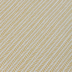 Detail of a wallpaper panel in a painterly herringbone print in yellow on a light blue field.