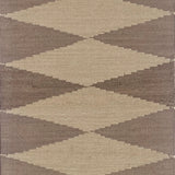 Geometric patterned rug with diamond shapes in brown and beige tones