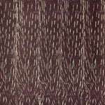 Detail of wallpaper in an abstract textural print in brown on a tan field.