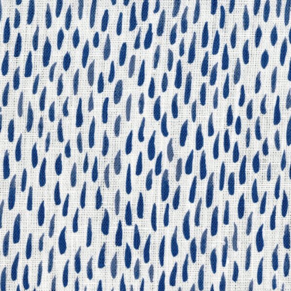 Fabric in a painterly dabbed print in navy on a white field.