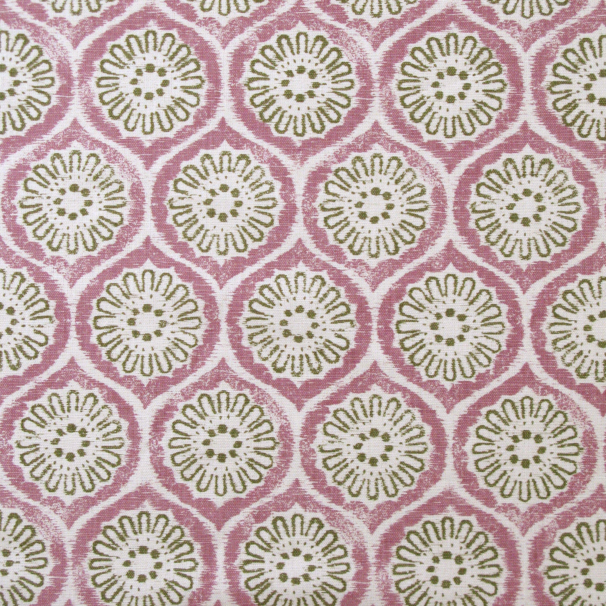 Detail of fabric in a floral lattice print in green and pink on a cream field.