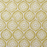 Detail of fabric in a floral lattice print in yellow on a cream field.