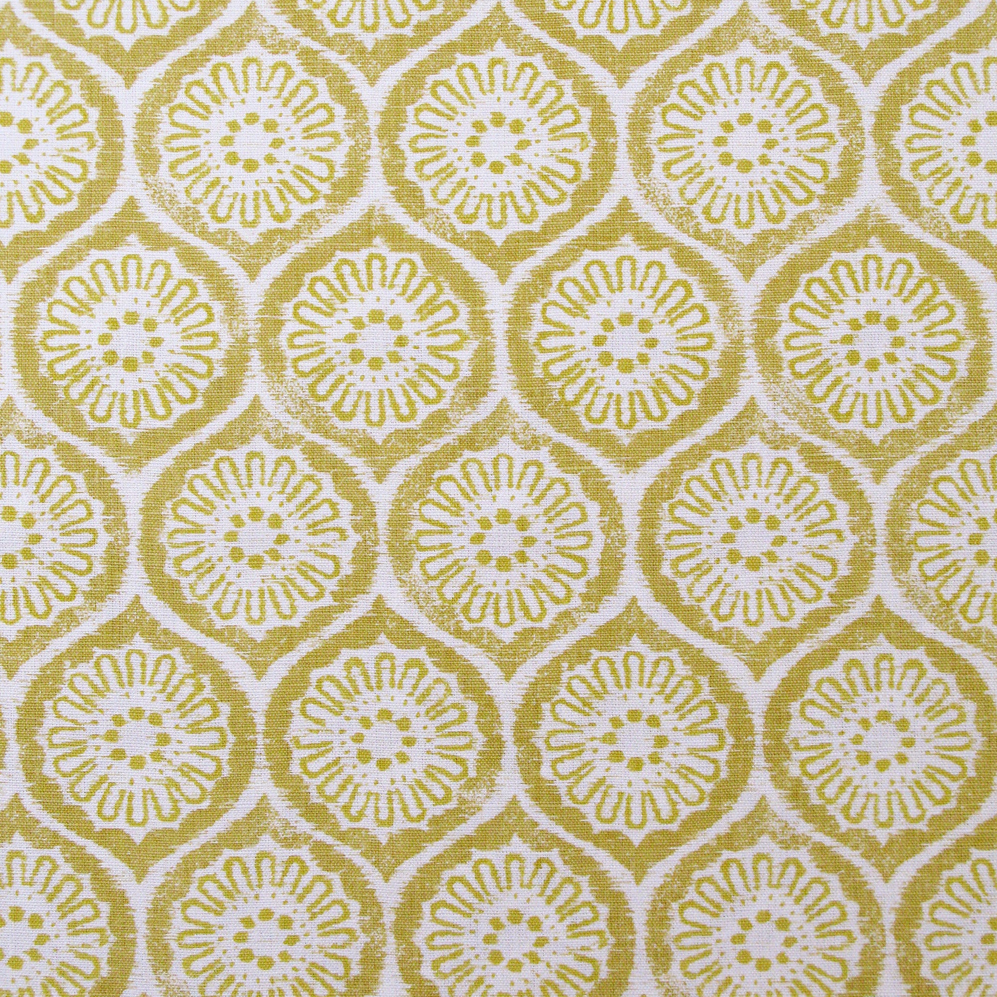 Detail of fabric in a floral lattice print in yellow on a cream field.