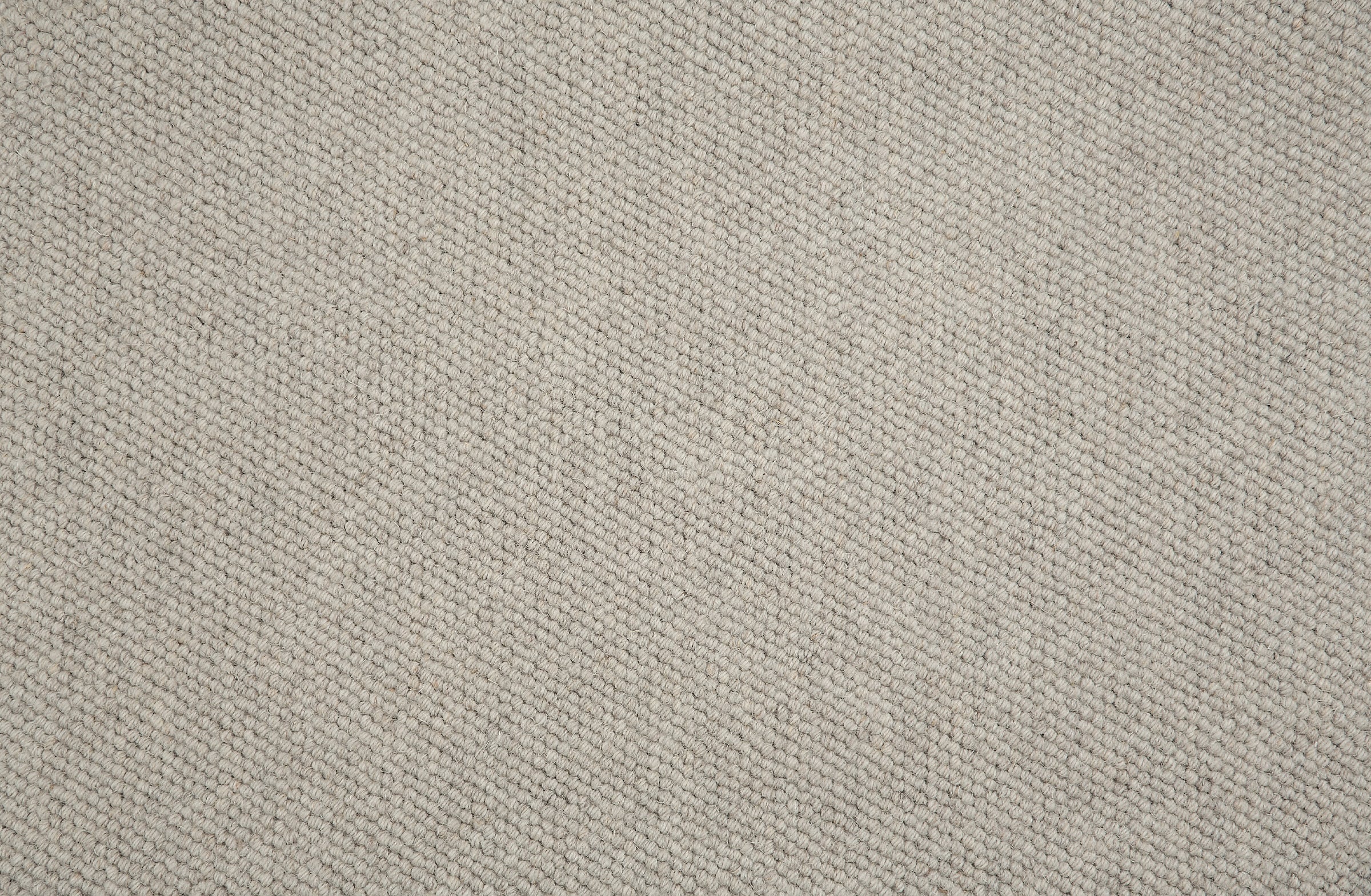 Close-up of loop broadloom carpet in beige.