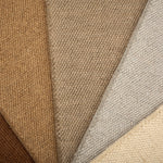 Close-up of loop broadloom carpet in a range of neutral colors. 