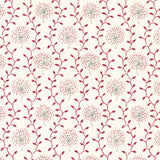 Detail of fabric in a repeating dandelion and leaf print in pink and red on a cream field.