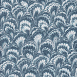 Detail of fabric in a marbled paint print in shades of blue, navy and white.