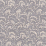 Detail of fabric in a marbled paint print in shades of gray and cream.