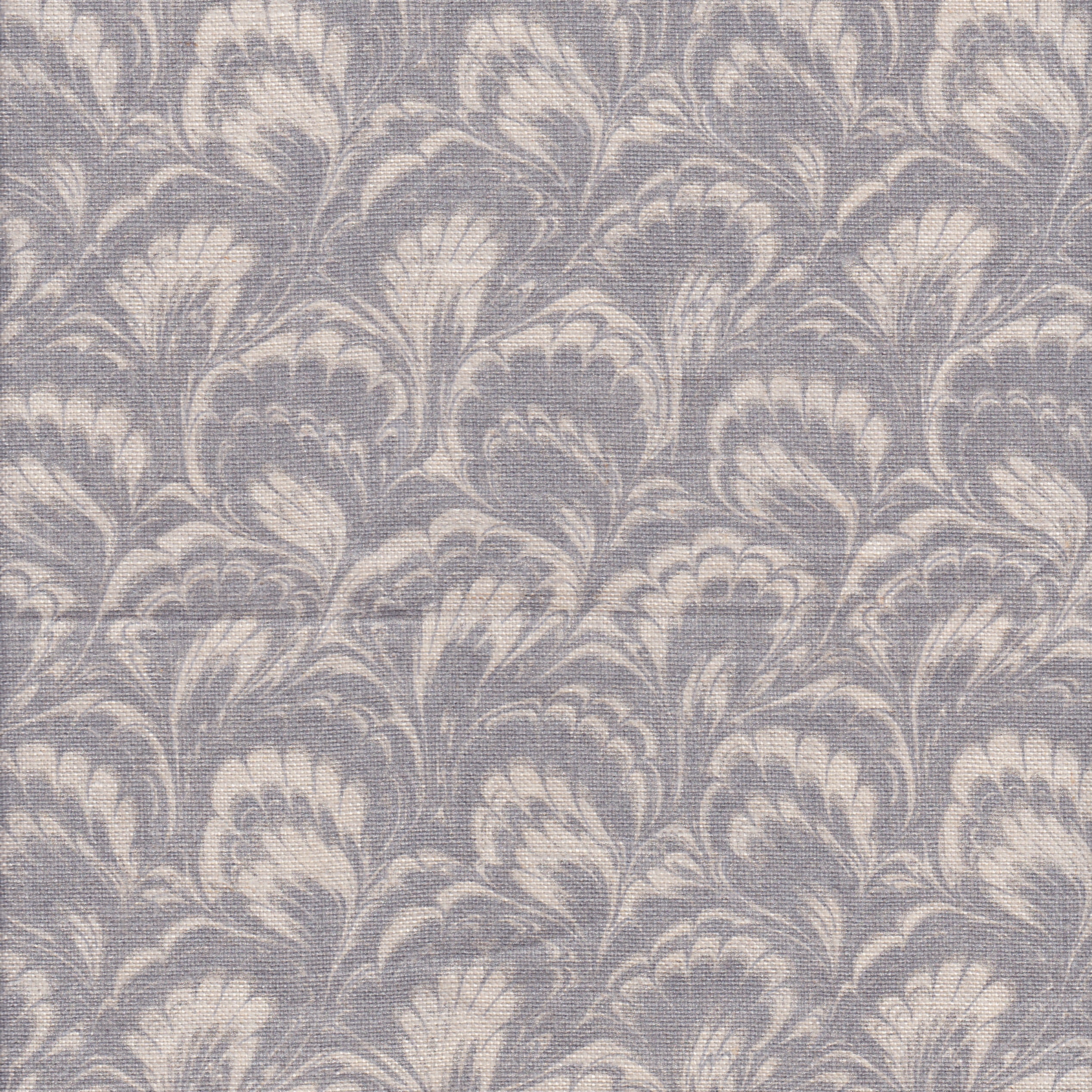 Detail of fabric in a marbled paint print in shades of gray and cream.