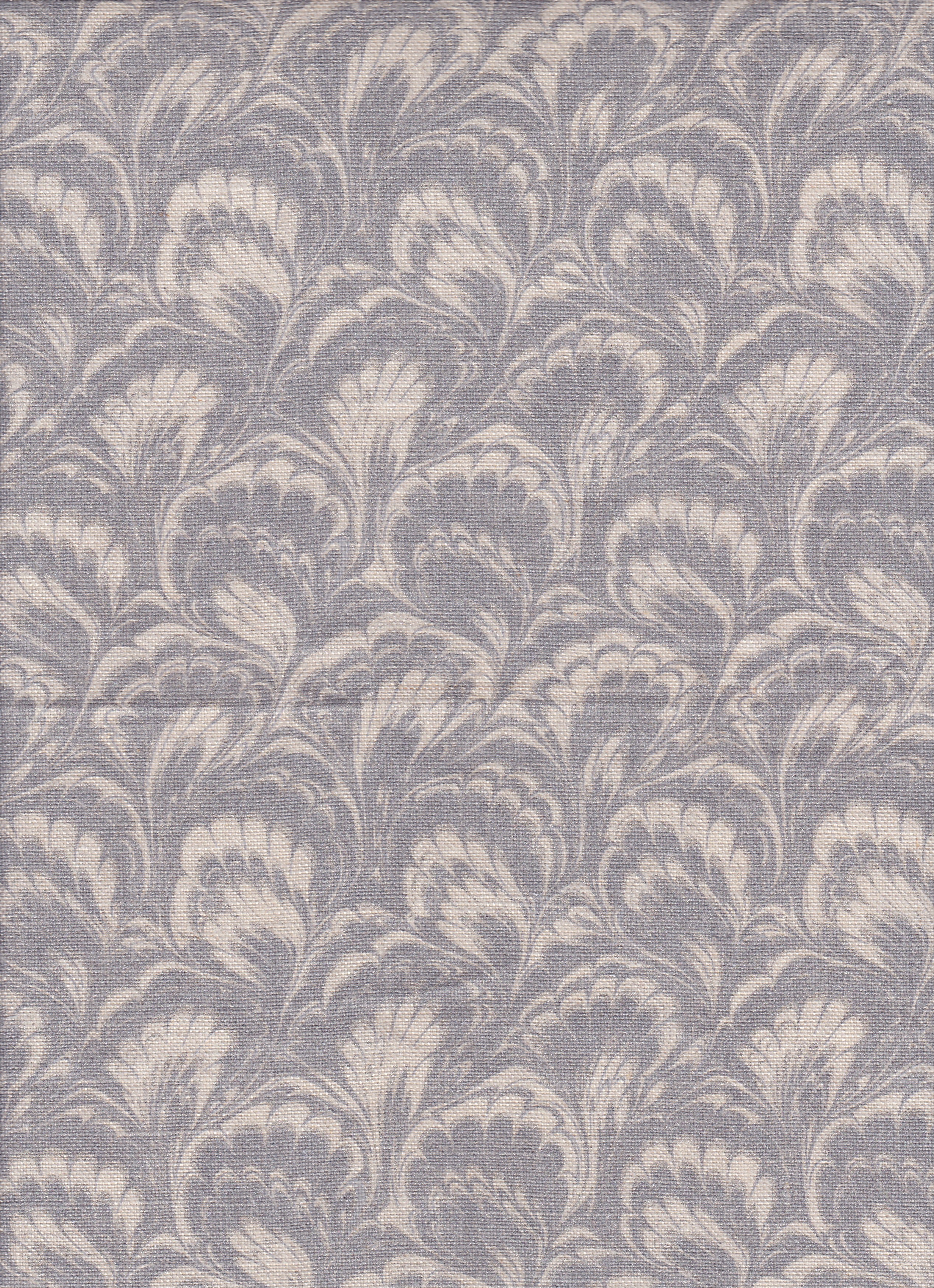 Detail of fabric in a marbled paint print in shades of gray and cream.