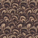 Detail of fabric in a marbled paint print in shades of brown and tan.