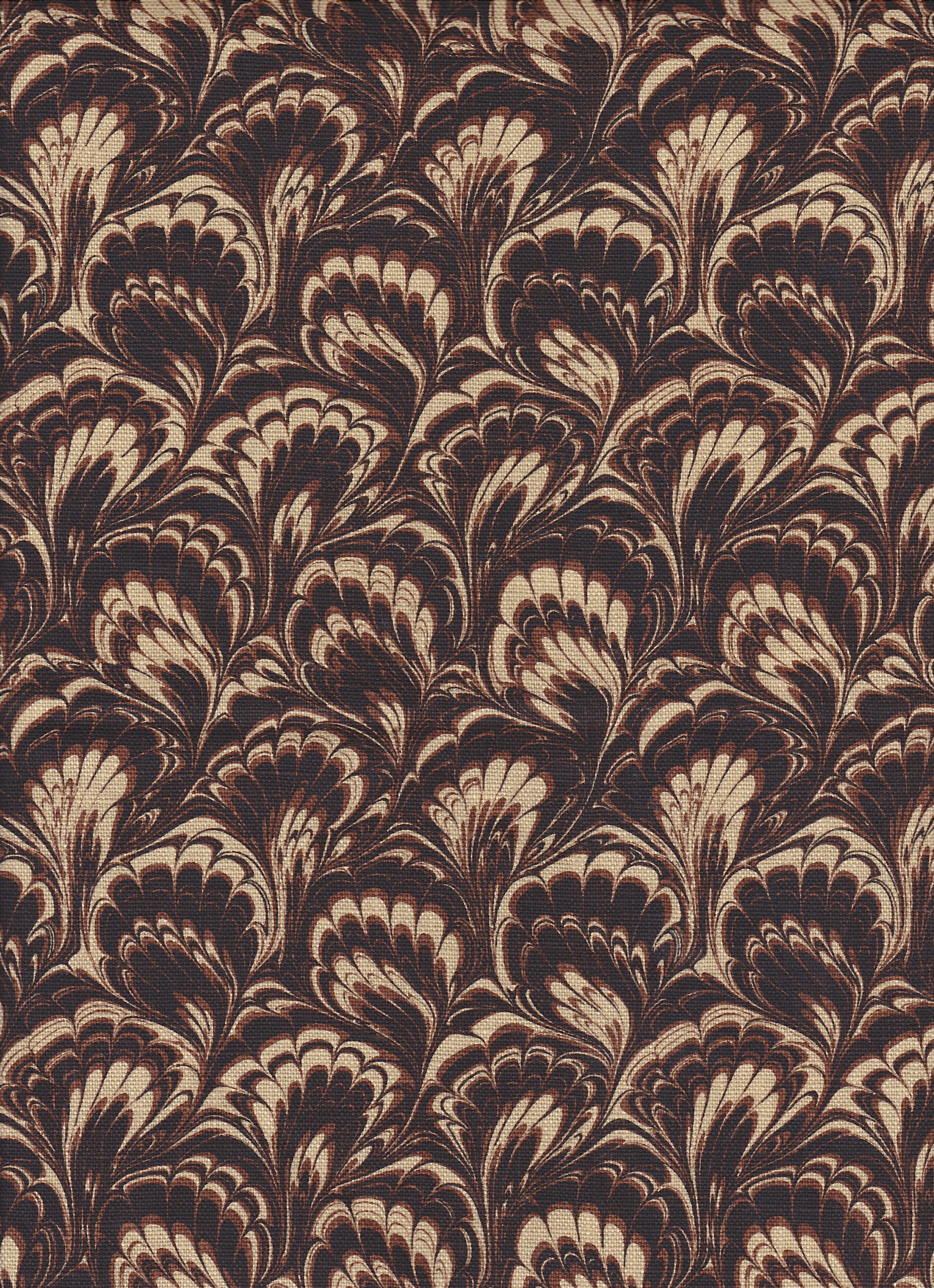 Detail of fabric in a marbled paint print in shades of brown and tan.