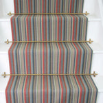 Striped flatweave runner in red tan blue grey on white staircase