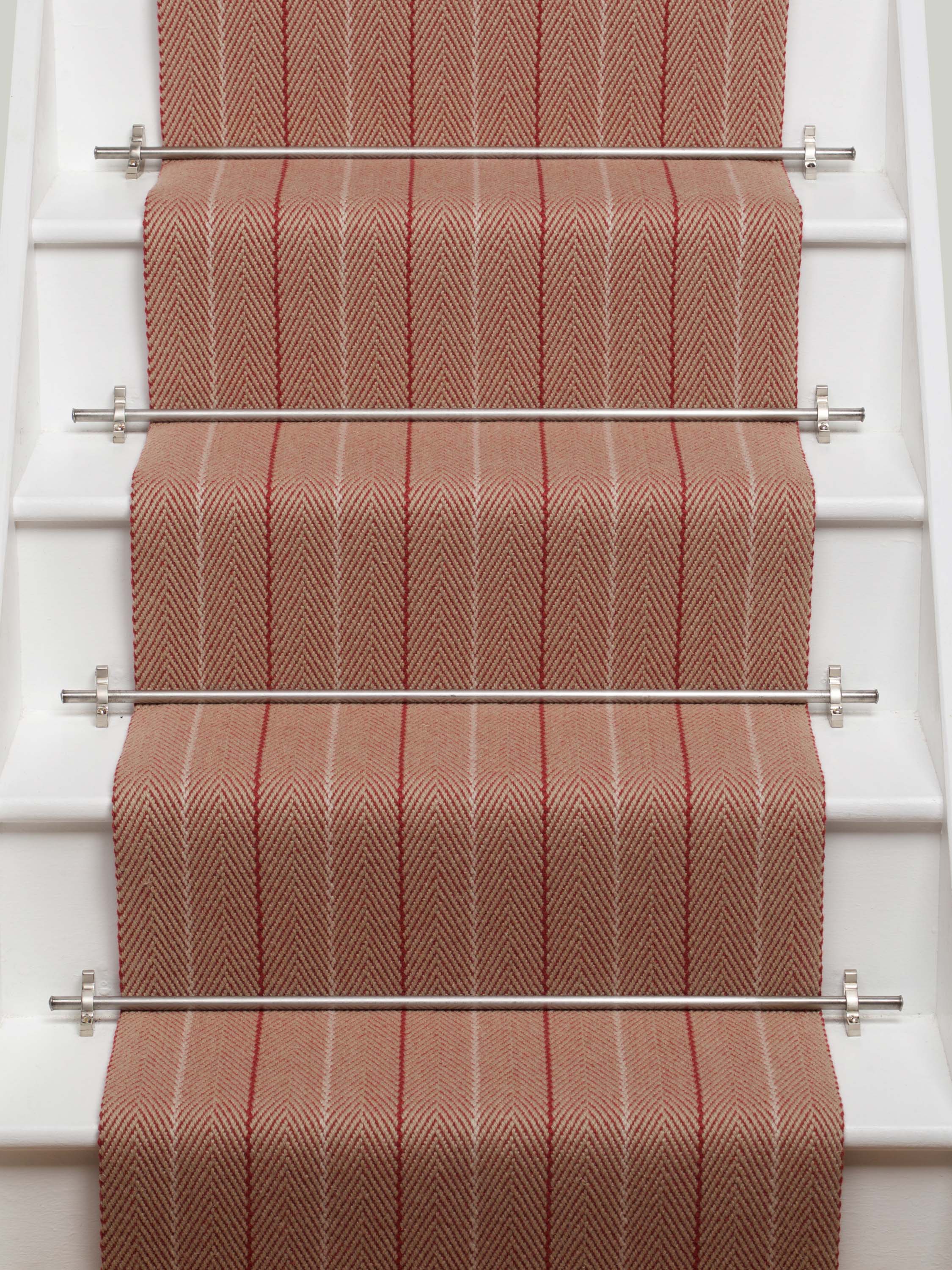 Striped flatweave runner in red and sand on white staircase