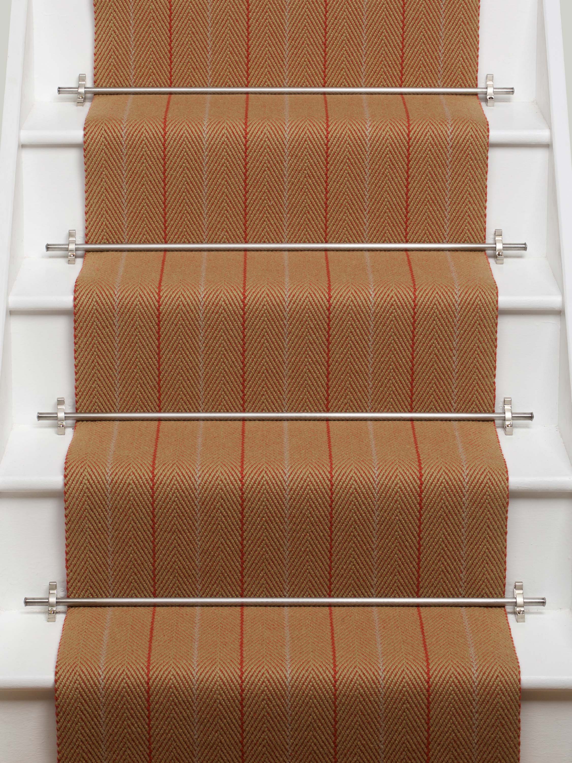 Striped flatweave runner in orange on white staircase