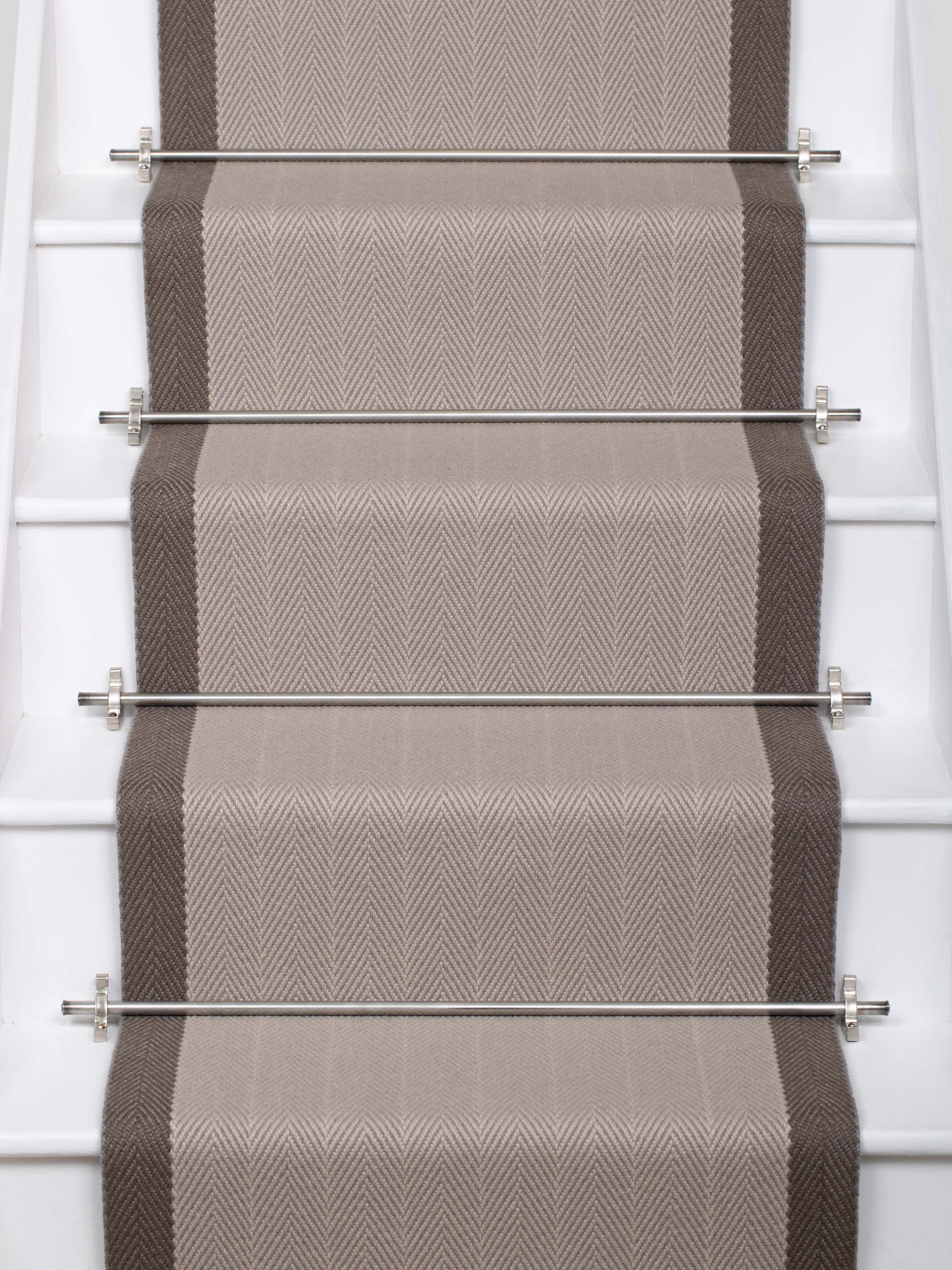 Striped flatweave runner in grey and dark grey on white staircase