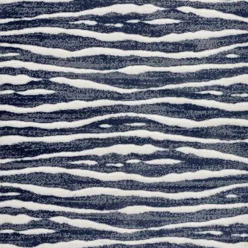 Broadloom carpet swatch in wavy striped pattern blue color