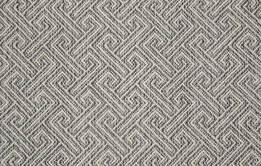 Broadloom carpet swatch in wavy geometric pattern dark grey color