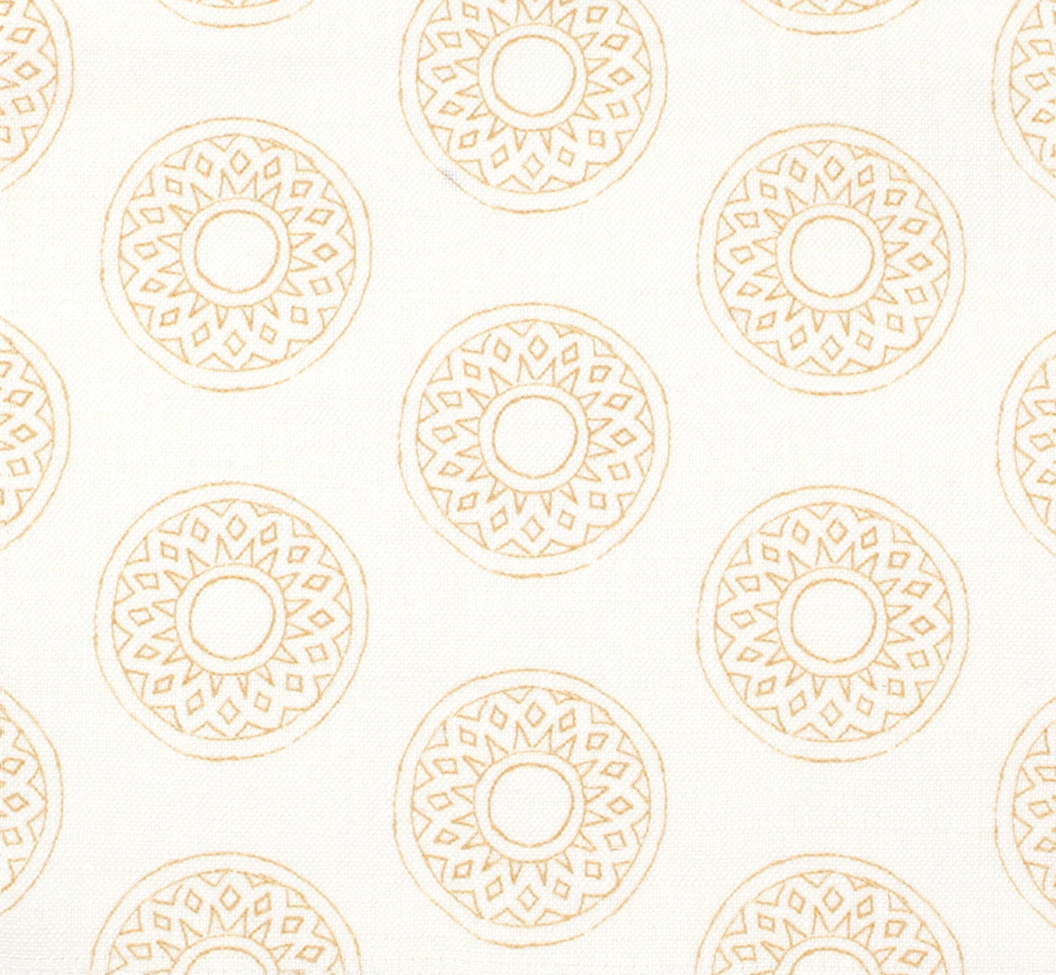 Detail of fabric in a repeating circular geometric print in yellow on a white field.