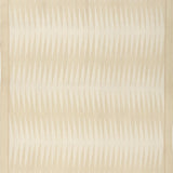 Handwoven rug in a geometric design in shades of beige. 