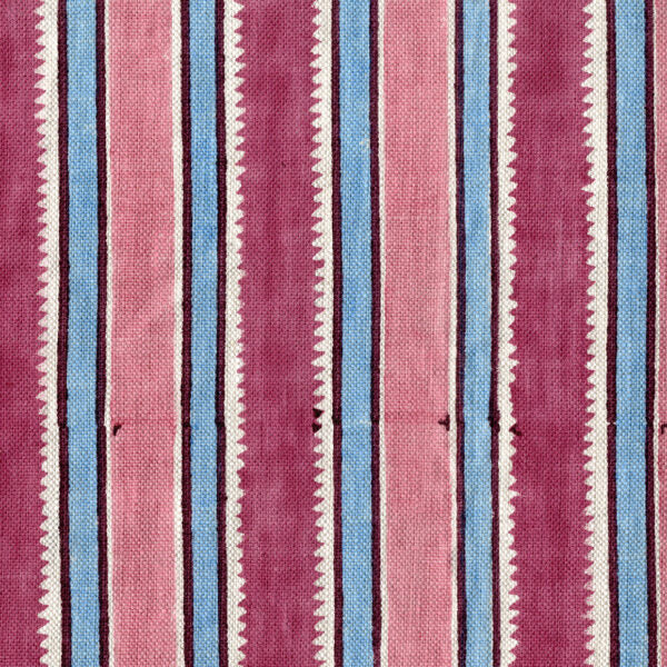 Fabric in a playful irregular stripe pattern in shades of pink, blue and cream.