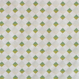 Detail of fabric in a textural diamond lattice print in shades of green on a cream field.