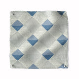 Square fabric swatch in a textural diamond lattice print in blue on a cream field.